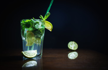 Fresh cocktail on a black background. Alcoholic cocktail on a black background. Fruit with a cocktail. Non-alcoholic cocktail. Mix of cocktails on a black background. 