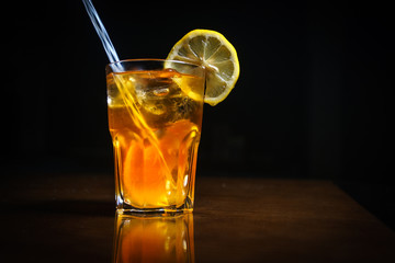 Fresh cocktail on a black background. Alcoholic cocktail on a black background. Fruit with a cocktail. Non-alcoholic cocktail. Mix of cocktails on a black background. 