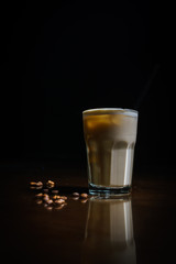 Coffee drinks on a black background. Coffee on a black table. Cold coffee. Latte. Cappuccino. Espresso. Coffee cocktails. Milkshakes. Whipped cream. Barista