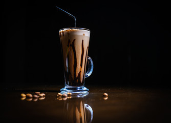 Coffee drinks on a black background. Coffee on a black table. Cold coffee. Latte. Cappuccino. Espresso. Coffee cocktails. Milkshakes. Whipped cream. Barista