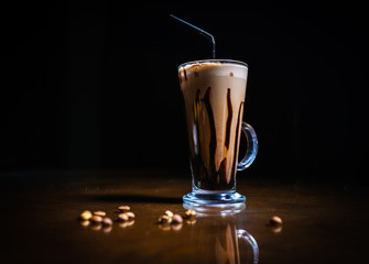 Coffee drinks on a black background. Coffee on a black table. Cold coffee. Latte. Cappuccino. Espresso. Coffee cocktails. Milkshakes. Whipped cream. Barista