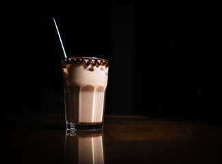 Coffee drinks on a black background. Coffee on a black table. Cold coffee. Latte. Cappuccino. Espresso. Coffee cocktails. Milkshakes. Whipped cream. Barista