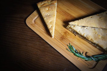 Piece of cake on a wooden board. Brownie. It's cake. Cake on a plate. A piece of cake on a plate with coffee.