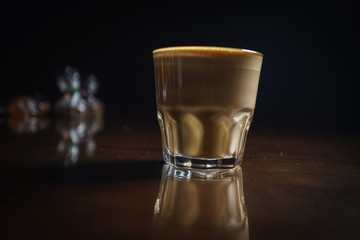 Coffee drinks on a black background. Coffee on a black table. Cold coffee. Latte. Cappuccino. Espresso. Coffee cocktails. Milkshakes. Whipped cream. Barista