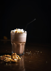 Coffee drinks on a black background. Coffee on a black table. Cold coffee. Latte. Cappuccino. Espresso. Coffee cocktails. Milkshakes. Whipped cream. Barista
