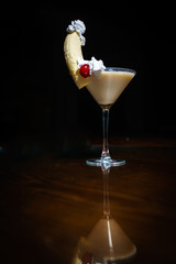 Fresh cocktail on a black background. Alcoholic cocktail on a black background. Fruit with a cocktail. Non-alcoholic cocktail. Mix of cocktails on a black background. 