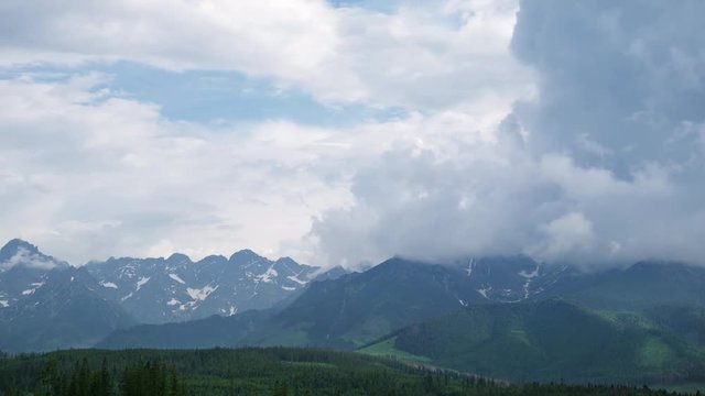 Time Lapse 4K Video in the Mountains range High Tatras in Poland with cumulus clouds.