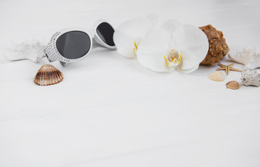 Shells, orchids and sunglasses