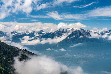 Fototapeta na wymiar Switzerland, scenic view on alps near Montreux, with fog, clouds