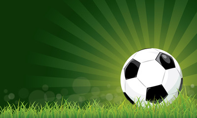 Football ball on grass field stadium green background.