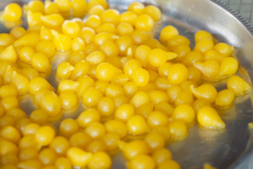 Egg Yoke fudge balls cooked in syrup.