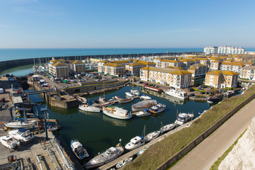 Fototapeta na wymiar Brighton marina boats and buildings in East Sussex England UK near Eastbourne 