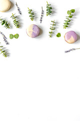 Spring pattern with macaroons and eucalyptus on white background
