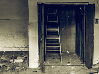 abandoned urbex ladder behind a door