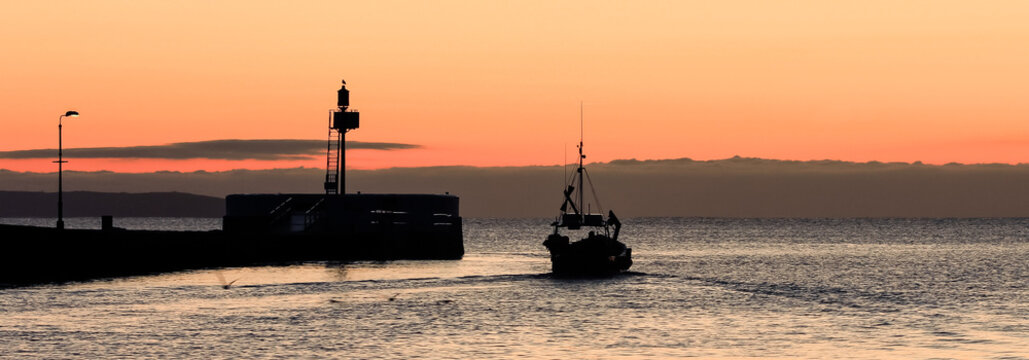 Departing Fishing Boat at sunrise, Looe, Cornwall