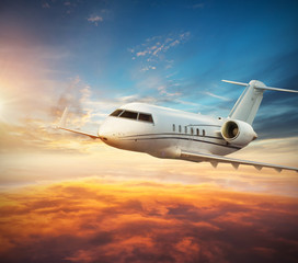 Fototapeta na wymiar Luxury private jetliner flying above clouds
