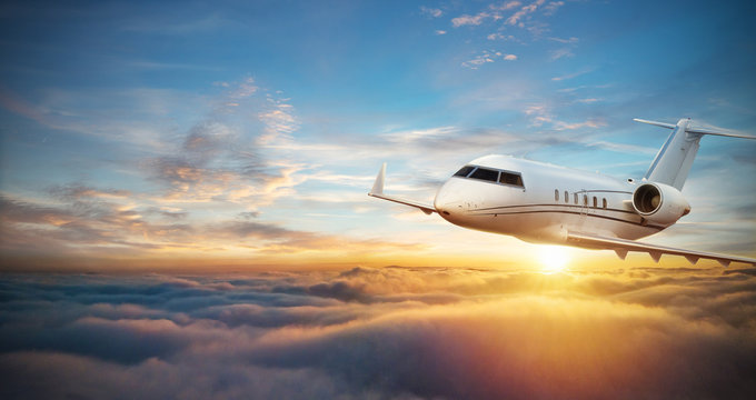 Luxury private jetliner flying above clouds
