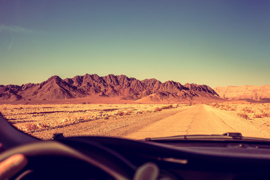 Driving a car on the road in the desert. The road to Timna Park near Eilat, Israel