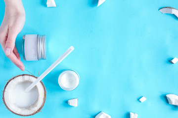 concept organic cosmetics with coconut on blue background top vi