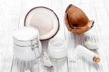 organic cosmetics with coconut on wooden background close up