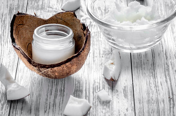 organic cosmetics with coconut on wooden background close up
