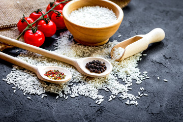 ingredients for paella on dark background