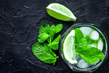 making mojito on dark background top view