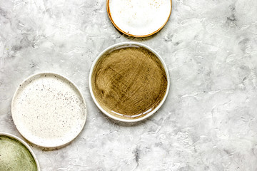 ceramic tableware top view on stone background mock up