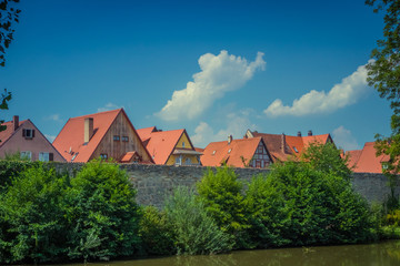 Rooftops above the city wall and the Wörnitz river in Dinkelsbühl