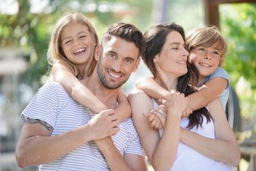 Portrait of happy family on summer day