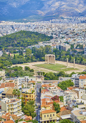 Fototapeta na wymiar Temple of Olympian Zeus, monumental sanctuary dedicated to Zeus, with Lisikratous avenue and Hadrian's arch in foreground. View from the Acropolis of Athens viewpoint. Attica region, Greece.