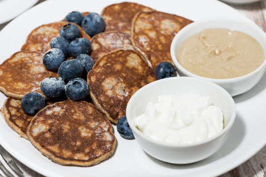 homemade pancakes with peanut butter and yoghurt, closeup