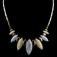 Modern golden pendant on a dark pattern