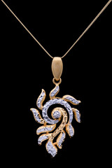 Modern golden pendant on a dark pattern