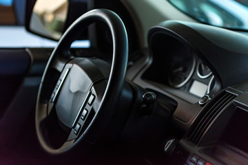 Fototapeta na wymiar Close-up modern car dashboard and steering wheel