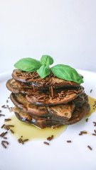 chocolate pancakes with maple syrup and basil
