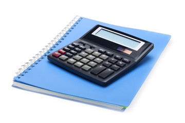 Calculator on top of a notebook