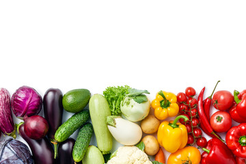 line made of different vegetables and berries isolated on white background. Copy space. Healthy eating background. Food photography. Top view