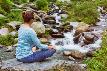 Woman in Padmasana outdoors