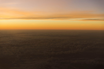 Sunset or sunlight above cloud view from airplane window. Beautiful view like heaven.