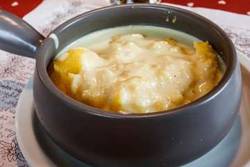 Hot polenta and cheese, homemade food in Cortina d'Ampezzo, Dolomites, Italy