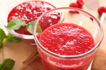 Glass of tasty raspberry smoothie, closeup