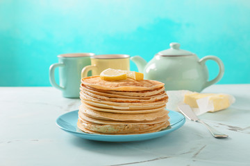 Stack of delicious thin pancakes on plate
