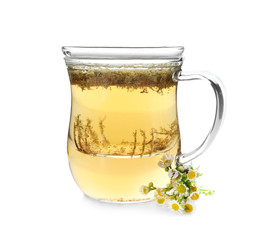 Glass cup of camomile tea on white background