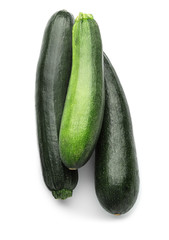 Ripe zucchinis on white background