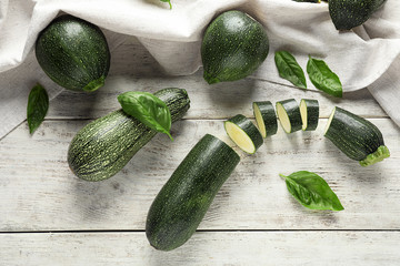 Fresh sliced zucchini on wooden table