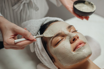 Cosmeotologist Applying a Facial Mask