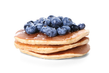 Tasty pancakes with blueberries on white background
