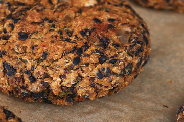 Vegan quinoa and bean burgers made with beans, quinoa, nori algae, oats, smoked peppers and onions