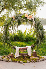 Arch for the wedding ceremony. Arch, decorated with beautiful fresh flowers and cloth.